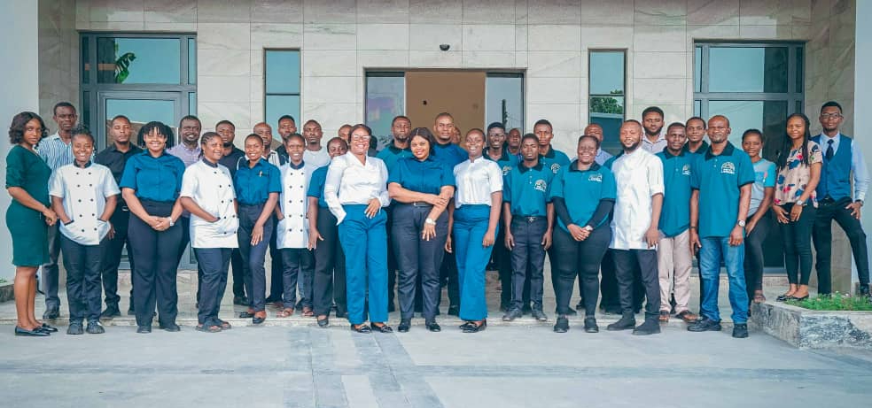Hotel staff and trainers after a training session